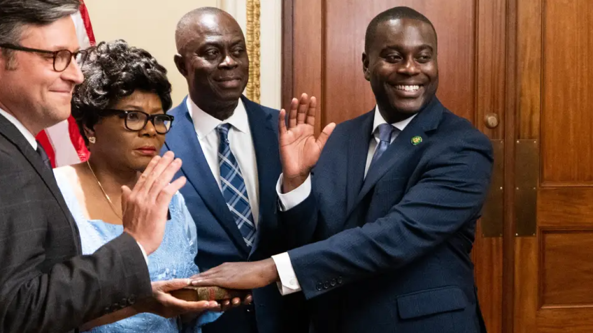 Speaker of the House Mike Johnson (L), participates in the ceremonial swearing in of Rep. Gabe Amo of Rhode Island (RI).