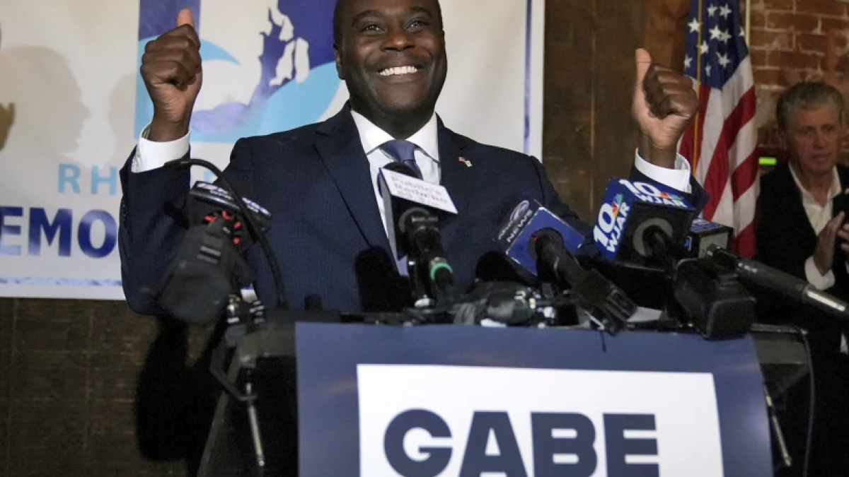 Democrat Gabe Amo gives both thumbs up to the room full of election night supporters, Tuesday, Nov. 7, 2023, at The Guild in Pawtucket, R.I., after winning Rhode Island’s 1st Congressional District seat. The former White House aide will become the state’s first Black candidate elected to the U.S. House. (Kris Craig/Providence Journal via AP)