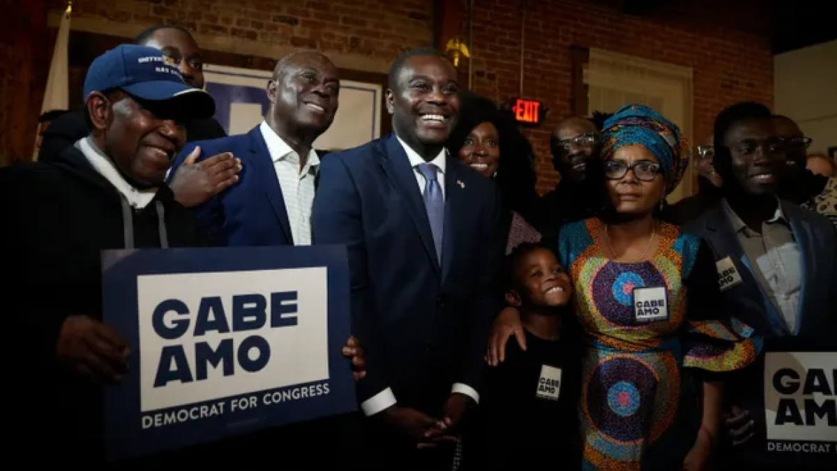 Newly elected 1st Congressional District Rep. Gabe Amo stands with members of his family, including his dad, Gabriel Amo, and his mother, Weady Socree (Kris Craig, The Providence Journal)