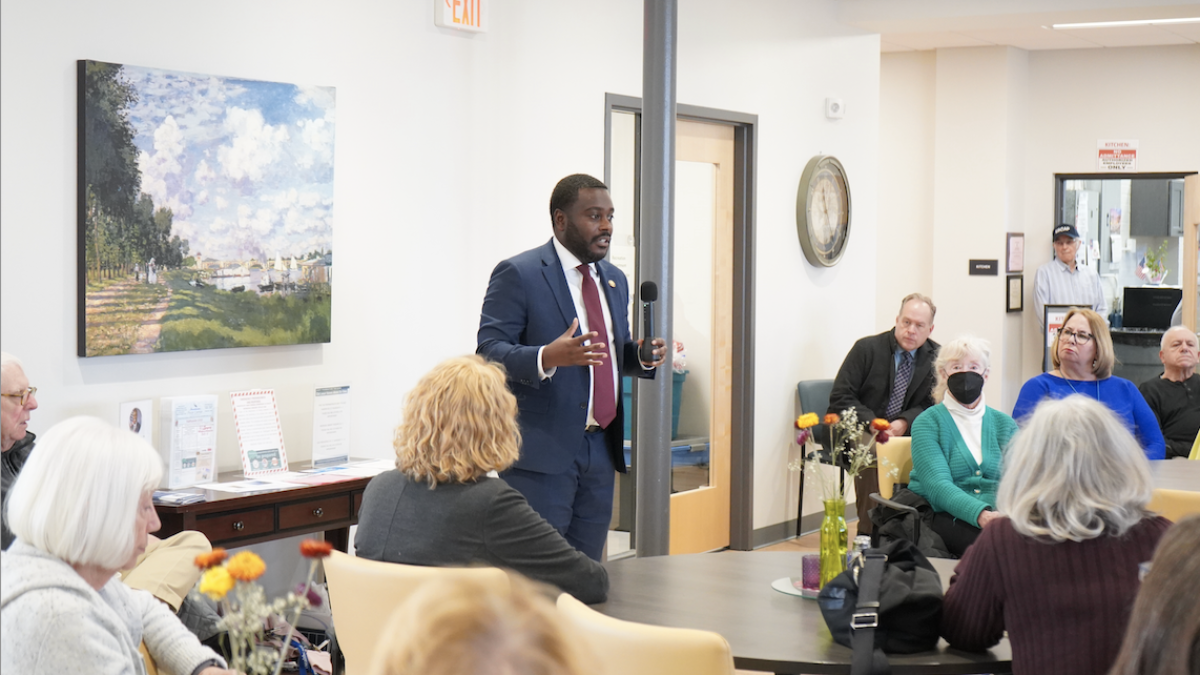 Congressman Amo addresses the crowd at Barrington Peck Center
