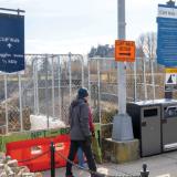 WALKERS HEADING south on the Newport Cliff Walk are stopped at Narragansett Avenue by fencing because part of the historic walk collapsed about two years ago. Visitors are required to detour through a nearby neighborhood to reconnect with the path farther south.
