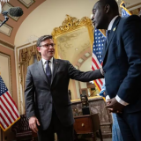 US House Speaker Mike Johnson, left, a Louisiana Republican, participates in a ceremonial swearing-in for new US Representative Gabe Amo., a Rhode Island Democrat, right, at the US Capitol on Monday. Amo is filling the seat formerly held by Representative David N. Cicilline in Rhode Island's First Congressional District. He is joined by his parents, Weady Socree and Gabriel Amo.DREW ANGERER/GETTY