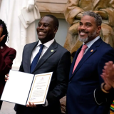 US Representative Gabe Amo (D-RI) (C), the first Black representative from Rhode Island, is sworn in as the 60th member of the Congressional Black Caucus in Statuary Hall at the US Capitol in Washington, DC, on November 14, 2023. Amo is replacing former US Representative David Cicilline, who resigned from Congress to become president and CEO of the Rhode Island Foundation. (Photo by Stefani Reynolds / AFP) (Photo by STEFANI REYNOLDS/AFP via Getty Images)