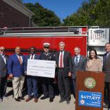Senator Whitehouse and Congressman Amo present a check to Smithfield Town Manager Randy Rossi, Smithfield Fire Chief Robert Seltzer, and other local leaders
