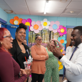 Congressman Amo speaks with staff at West End Community Center